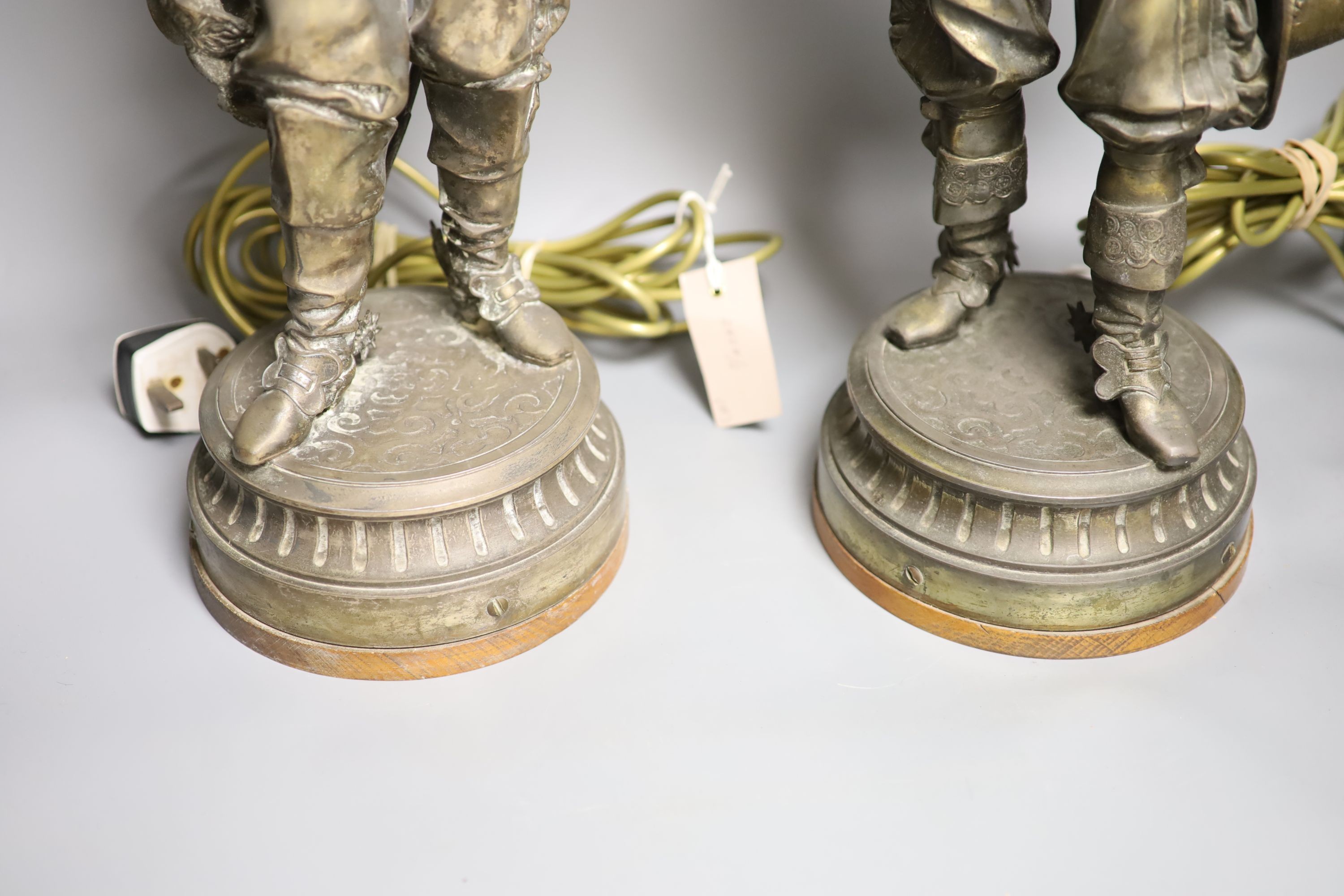 A pair of patinated spelter ’cavalier’ table lamps, early 20th century, 76 cm